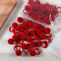 Lot de 20 chouchous à pompons en peluche