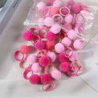 Lot de 20 chouchous à pompons en peluche